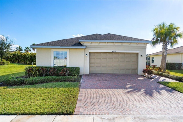 view of front facade with a front yard and a garage