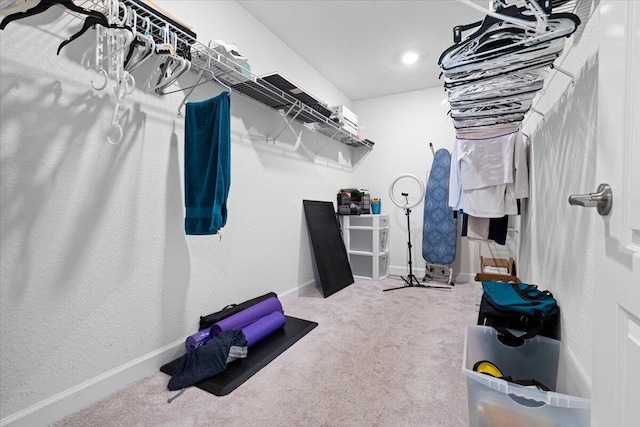 walk in closet featuring carpet