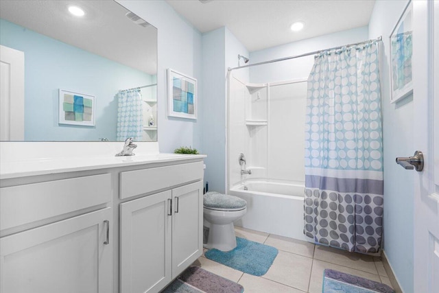 full bathroom featuring tile patterned flooring, shower / bath combo, vanity, and toilet