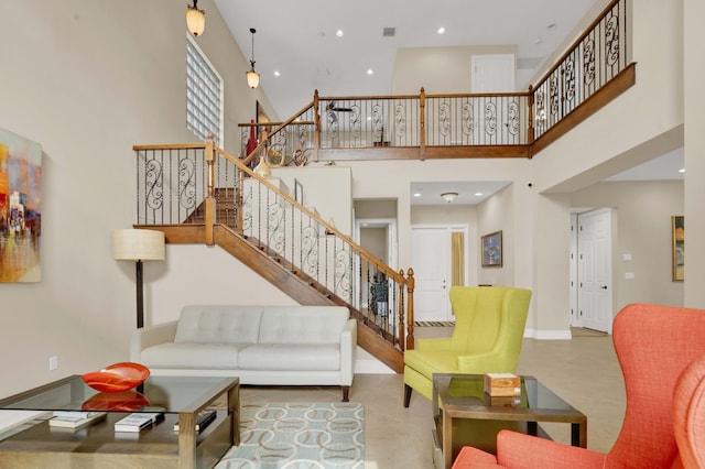 living room featuring a high ceiling