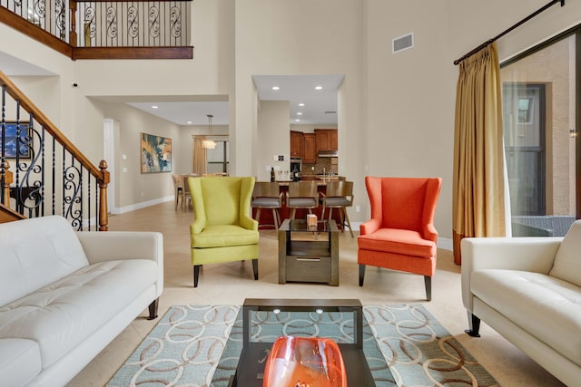 living room with a towering ceiling