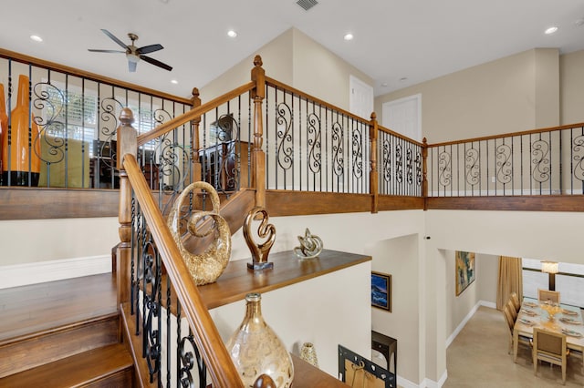 stairway with ceiling fan