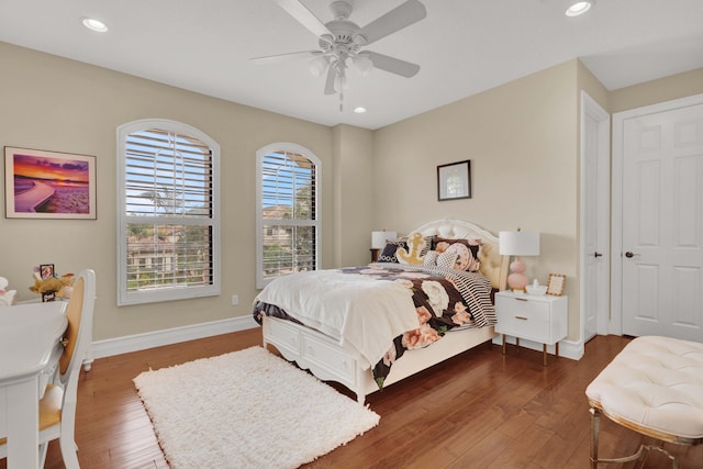 bedroom featuring dark hardwood / wood-style flooring and ceiling fan