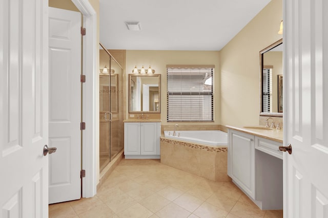 bathroom featuring tile patterned floors, vanity, and separate shower and tub