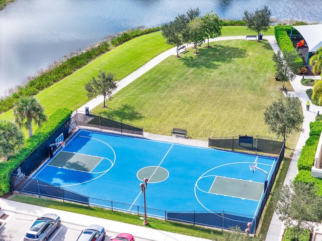 view of sport court featuring a water view