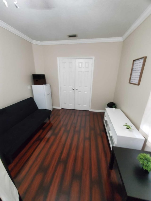 home office featuring crown molding and dark wood-type flooring