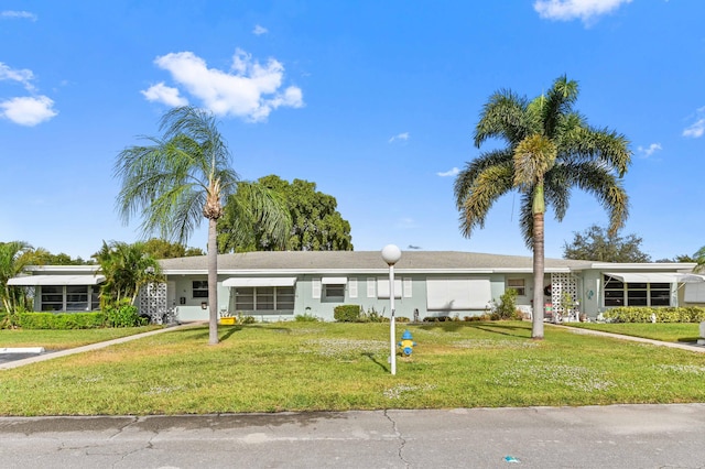 ranch-style home with a front yard