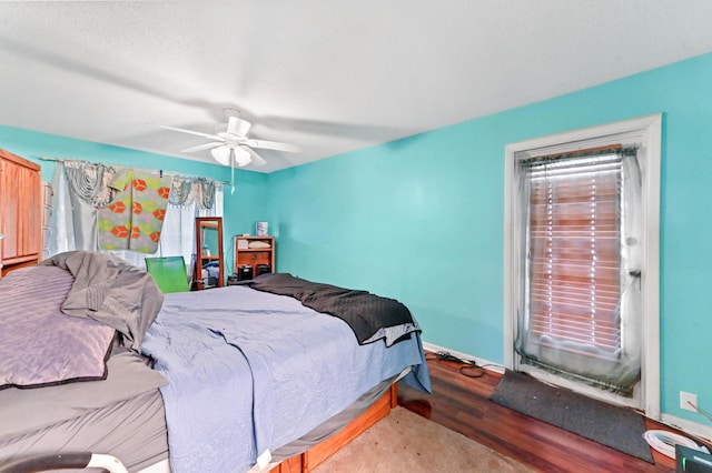 bedroom with ceiling fan and wood-type flooring