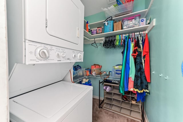 laundry room featuring stacked washer / dryer