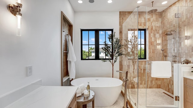 bathroom with vanity and plus walk in shower