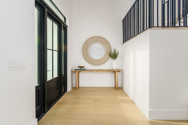 hall with light wood-type flooring