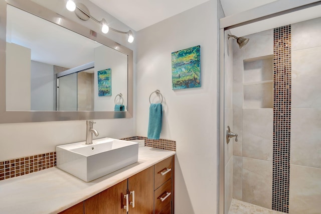 bathroom featuring vanity and a shower with shower door