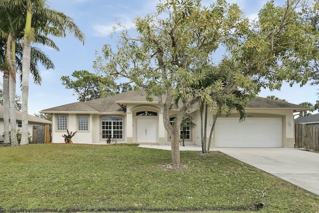 view of front facade with a garage and a front lawn