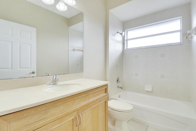 full bathroom with tile patterned flooring, vanity, toilet, and tiled shower / bath