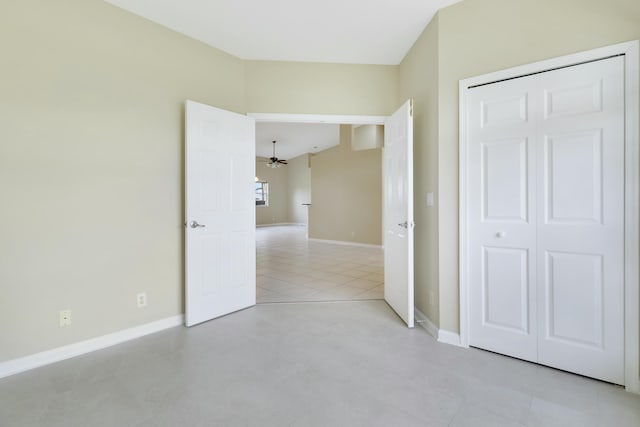 unfurnished bedroom with light tile patterned floors and a closet