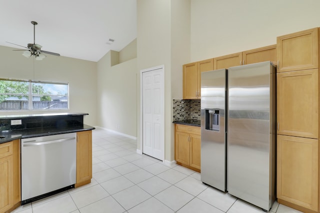 kitchen with backsplash, ceiling fan, light brown cabinetry, and stainless steel appliances