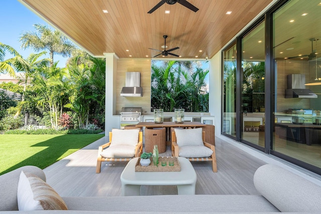 view of patio / terrace featuring area for grilling, ceiling fan, and grilling area