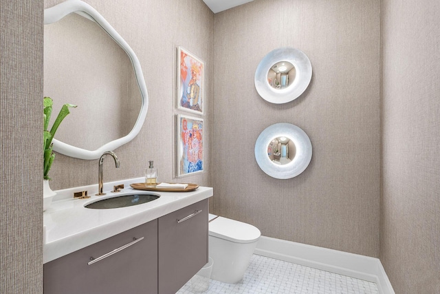 bathroom with tile patterned floors, vanity, and toilet