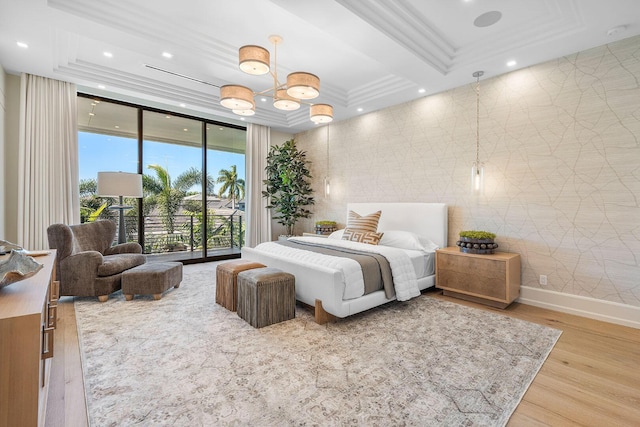 bedroom featuring hardwood / wood-style flooring, beam ceiling, access to exterior, and ornamental molding