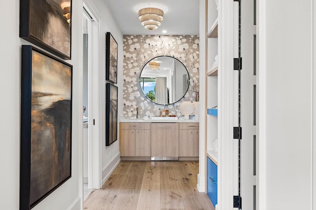 bathroom with hardwood / wood-style floors and vanity