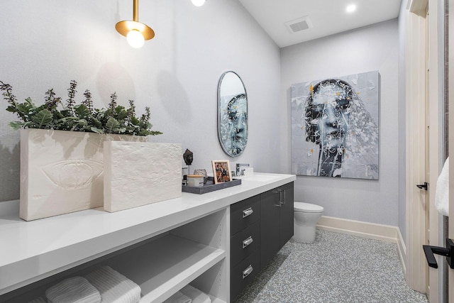 bathroom with vanity and toilet