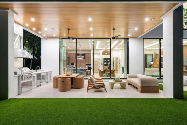 interior space with outdoor lounge area, ceiling fan, and area for grilling