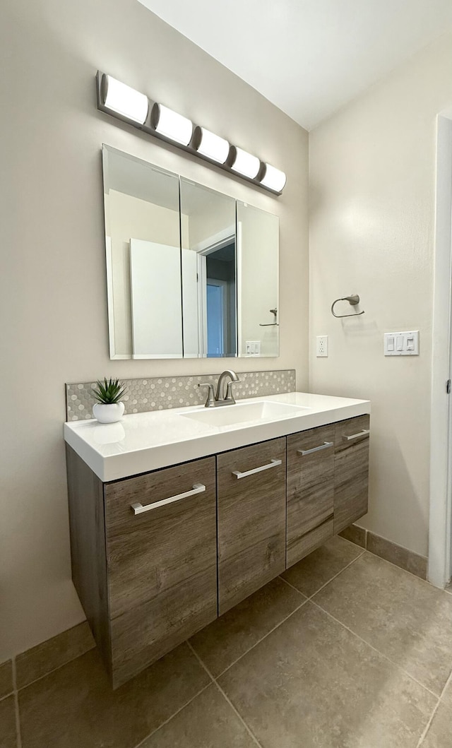 bathroom with tile patterned flooring and vanity