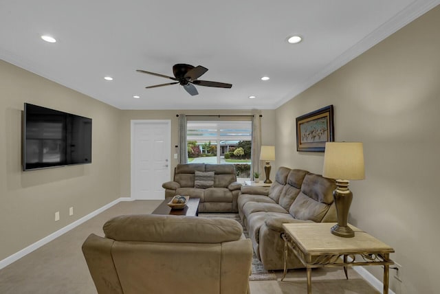 living room featuring ceiling fan and crown molding