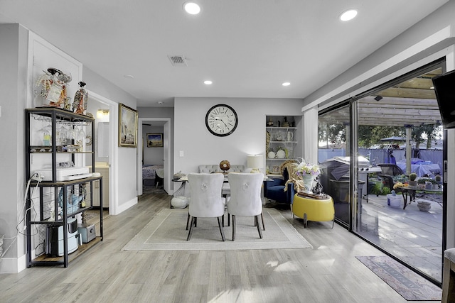 dining space featuring light hardwood / wood-style flooring