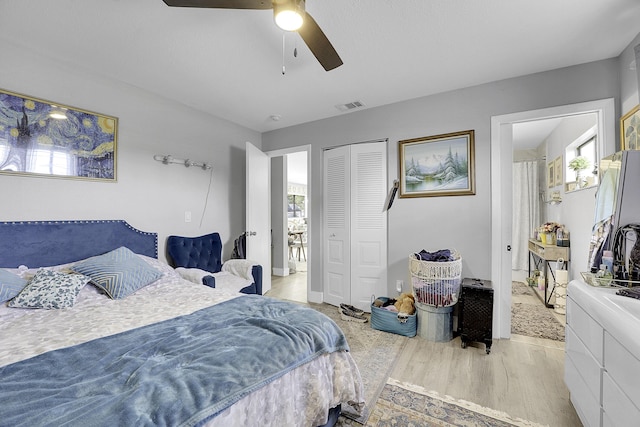 167 SW Tulip Blvd, Port Saint Lucie, FL 34953 - bedroom featuring wood finished floors, a closet, ceiling fan, and freestanding refrigerator