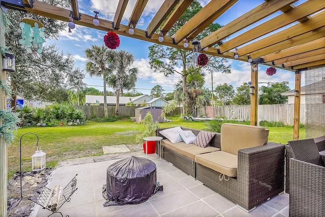 view of patio / terrace featuring a pergola, an outdoor hangout area, and a storage shed