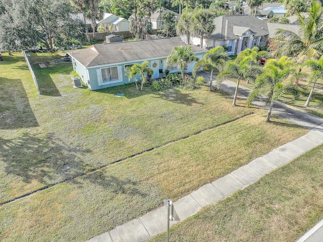 167 SW Tulip Blvd, Port Saint Lucie, FL 34953 - view of front of house with a residential view, a front yard, and stucco siding