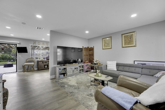 living room with light hardwood / wood-style flooring