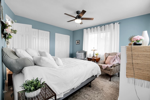 bedroom with two closets and ceiling fan