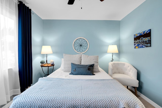 bedroom with hardwood / wood-style floors and ceiling fan