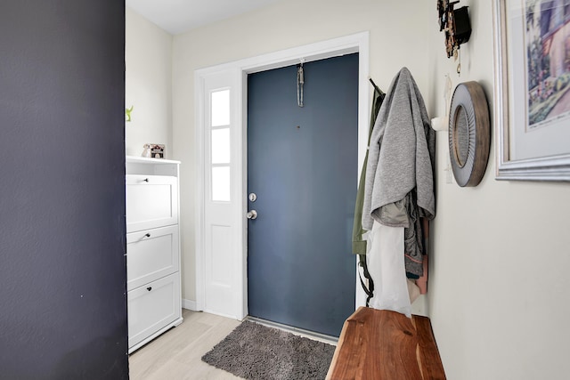 foyer entrance with light hardwood / wood-style floors