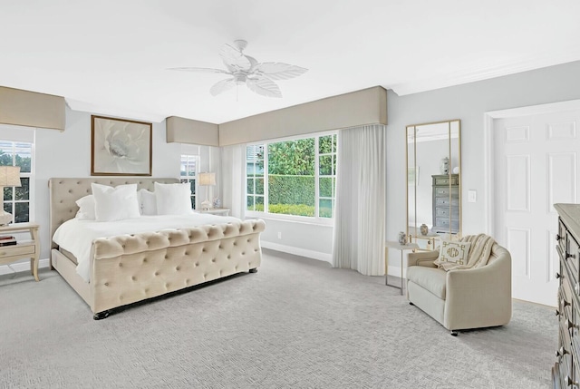 bedroom with ceiling fan and light colored carpet