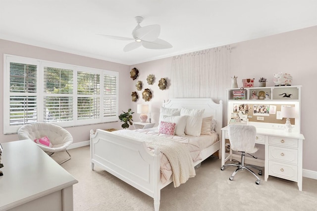 bedroom with multiple windows, light carpet, and ceiling fan