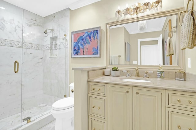 bathroom with vanity, toilet, an enclosed shower, and crown molding