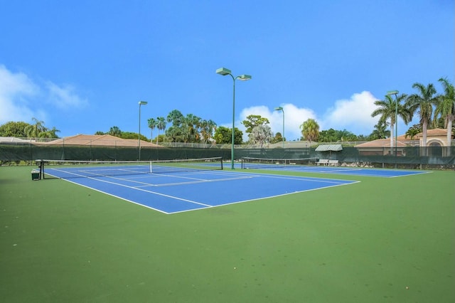 view of sport court featuring basketball hoop