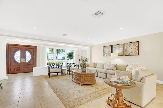 living room featuring french doors and light tile patterned floors