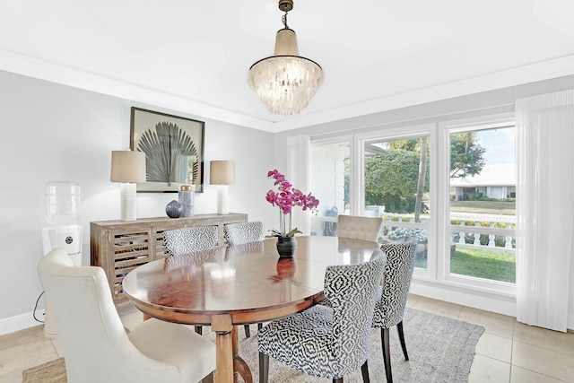 dining room featuring a chandelier, a wealth of natural light, ornamental molding, and light tile patterned flooring