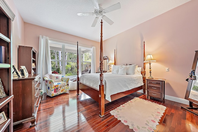 bedroom featuring a textured ceiling, dark hardwood / wood-style flooring, and ceiling fan