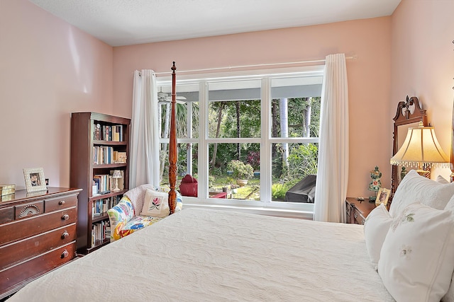 bedroom with multiple windows and a textured ceiling