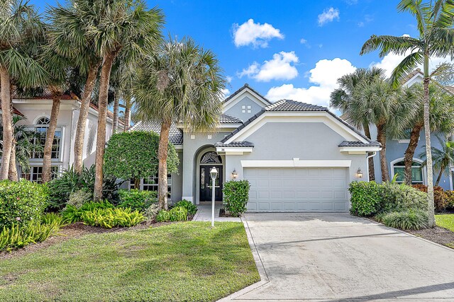 mediterranean / spanish-style home featuring a garage