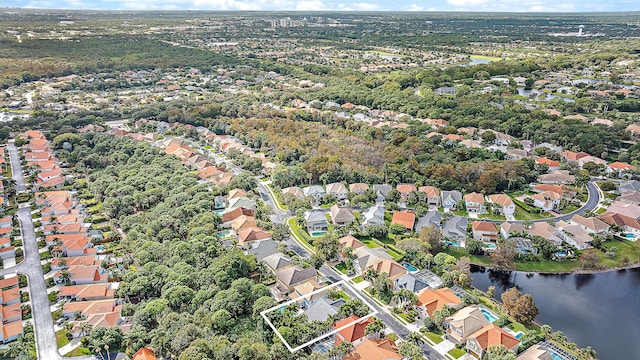 26 Princewood Ln, Palm Beach Gardens, FL 33410 - aerial overview of property's location featuring a large body of water, property boundaries highlighted, and nearby suburban area