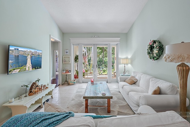 tiled living room with a textured ceiling