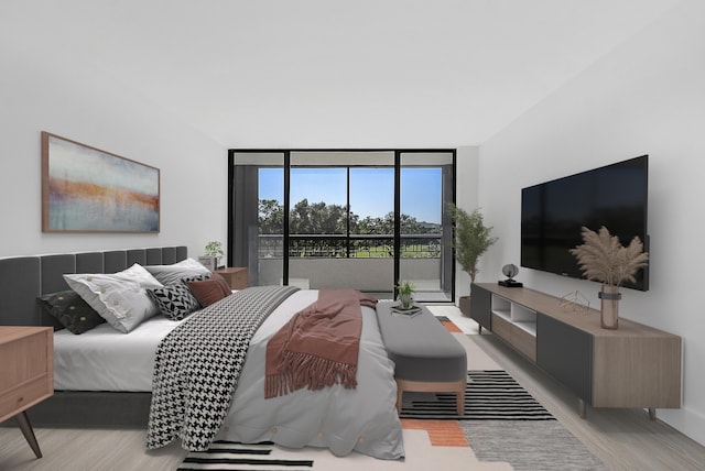 bedroom with access to outside, light wood-type flooring, and a wall of windows