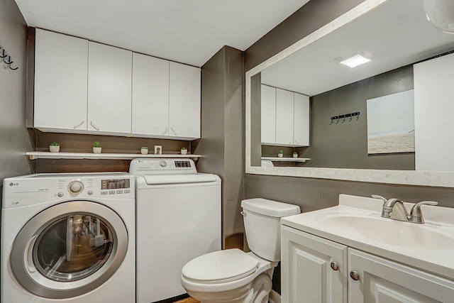 washroom featuring sink and washing machine and clothes dryer