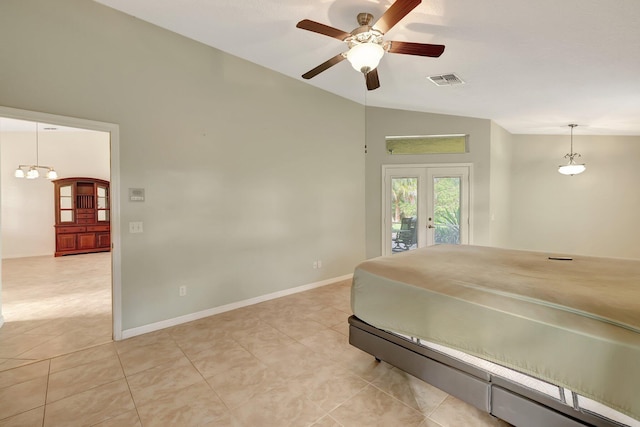 tiled bedroom with access to exterior, french doors, ceiling fan with notable chandelier, and lofted ceiling